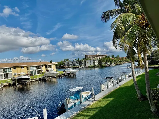 a view of a lake with houses with outdoor space