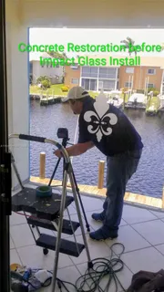 a view of a ocean with boats and trees in the background