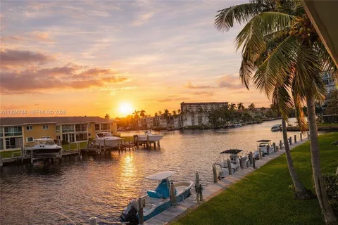 a view of a house and a yard