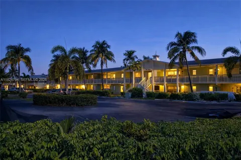 a kitchen with stainless steel appliances granite countertop a refrigerator stove and sink