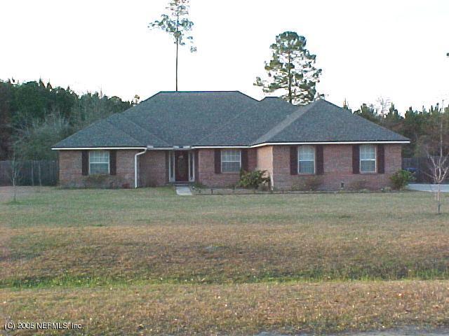 55574 Deer Run Road Callahan, FL 32011 - Photo 1 of 1 a backyard of a house