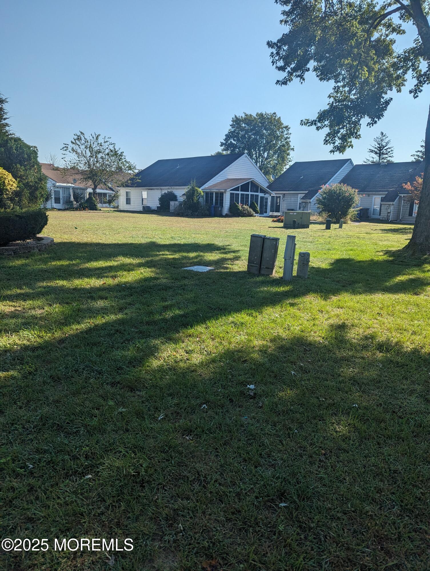 33 Dover Walk, Unit 633 Toms River, NJ 08753 - Photo 12 of 12 a view of a house with a big yard