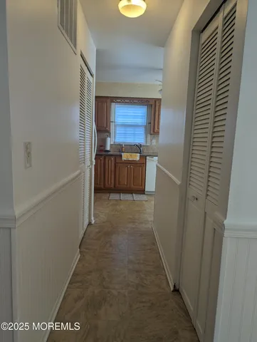 a view of hallway with washer and dryer