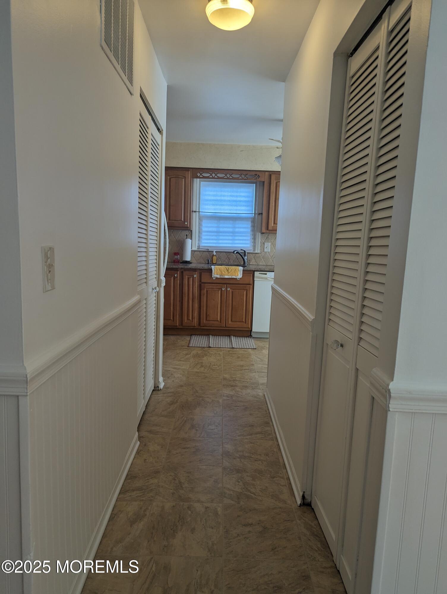 33 Dover Walk, Unit 633 Toms River, NJ 08753 - Photo 7 of 12 a view of hallway with washer and dryer
