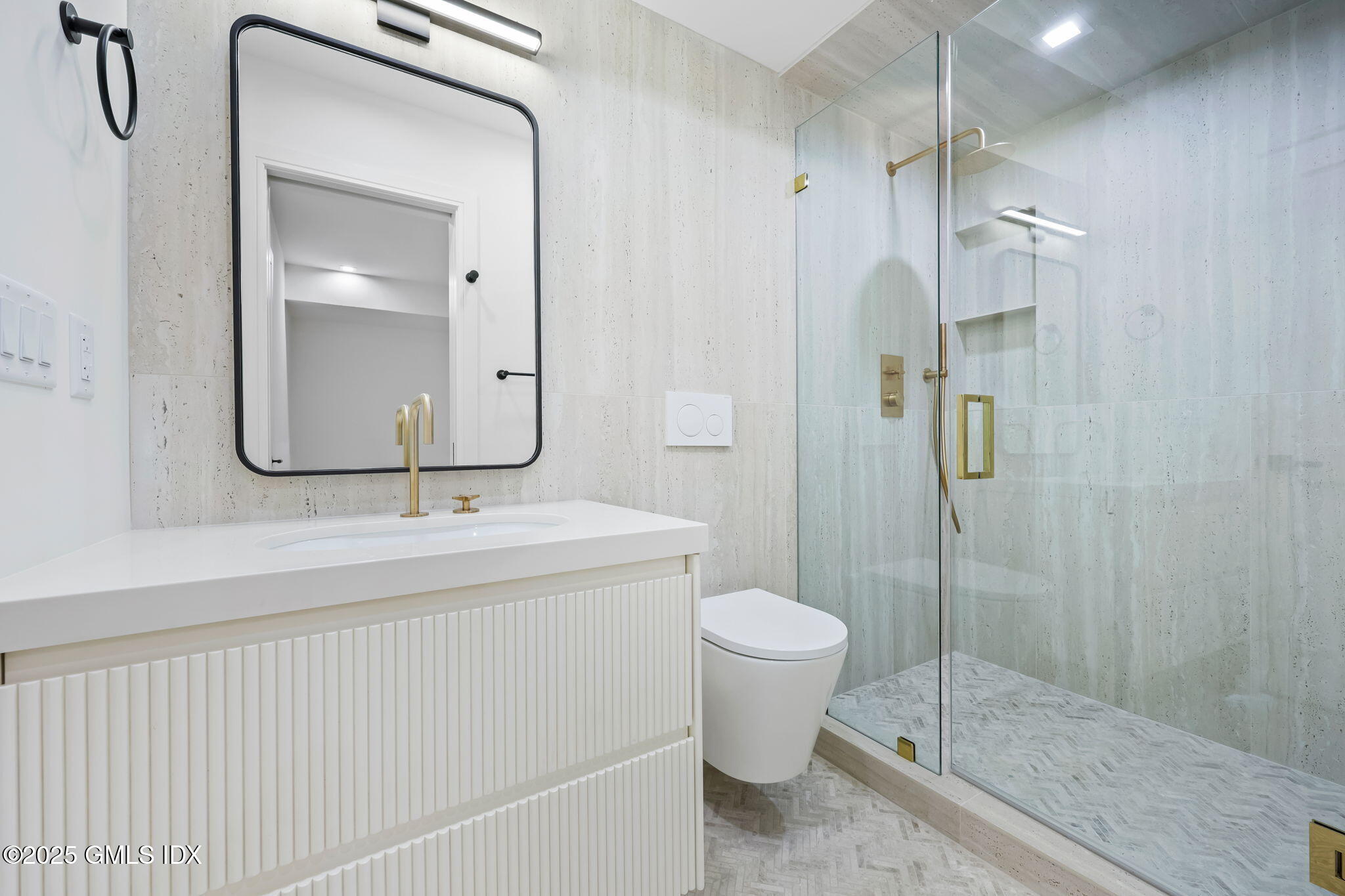 187 Field Point Road, Unit B Greenwich, CT 06830 - Photo 27 of 32 a bathroom with a sink a toilet and shower