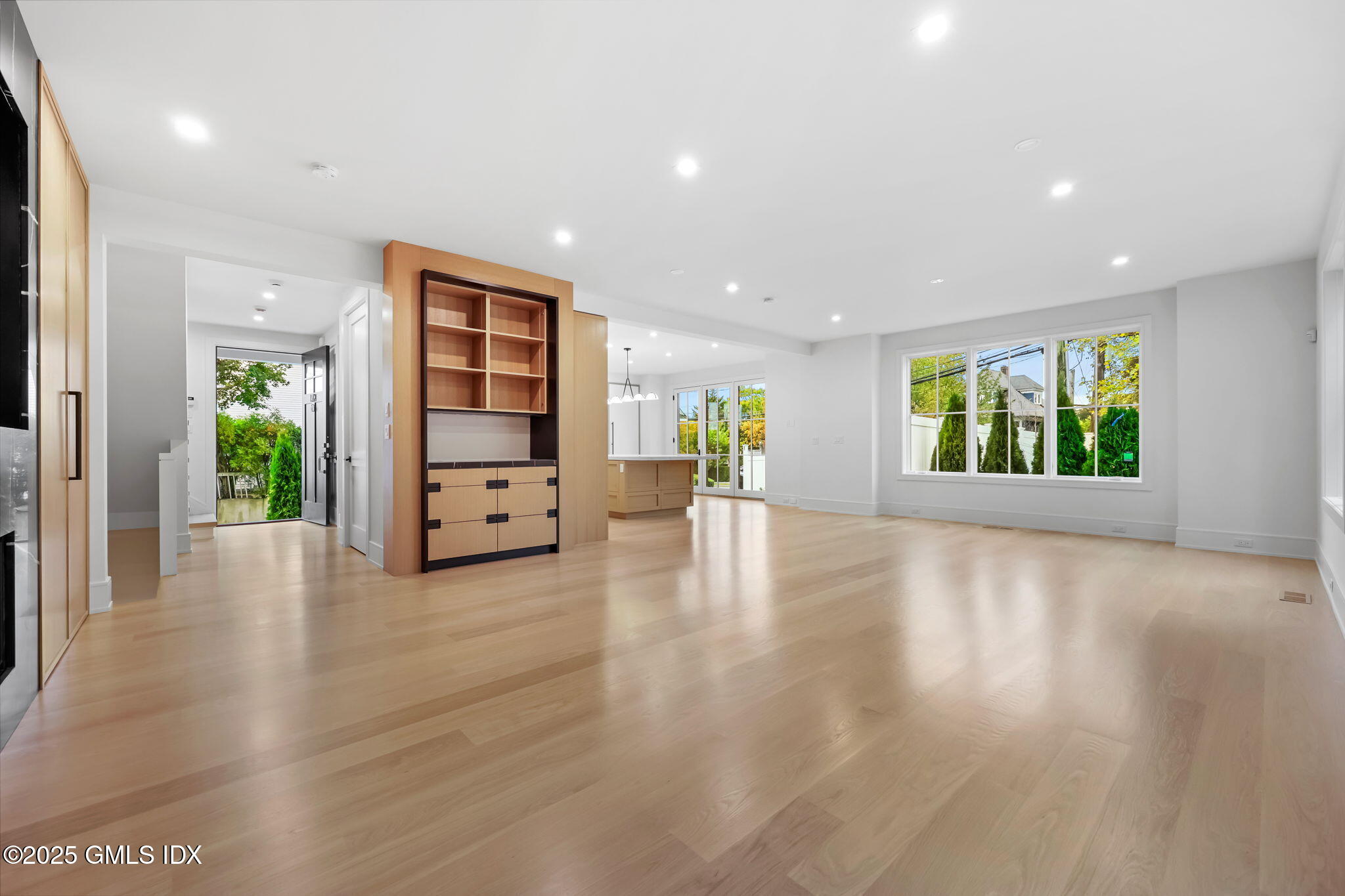 187 Field Point Road, Unit B Greenwich, CT 06830 - Photo 6 of 32 wooden floor in an empty room with a window
