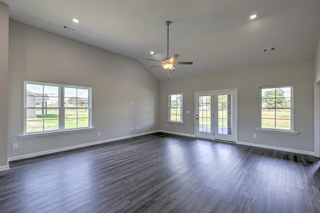a view of kitchen with refrigerator microwave and stove