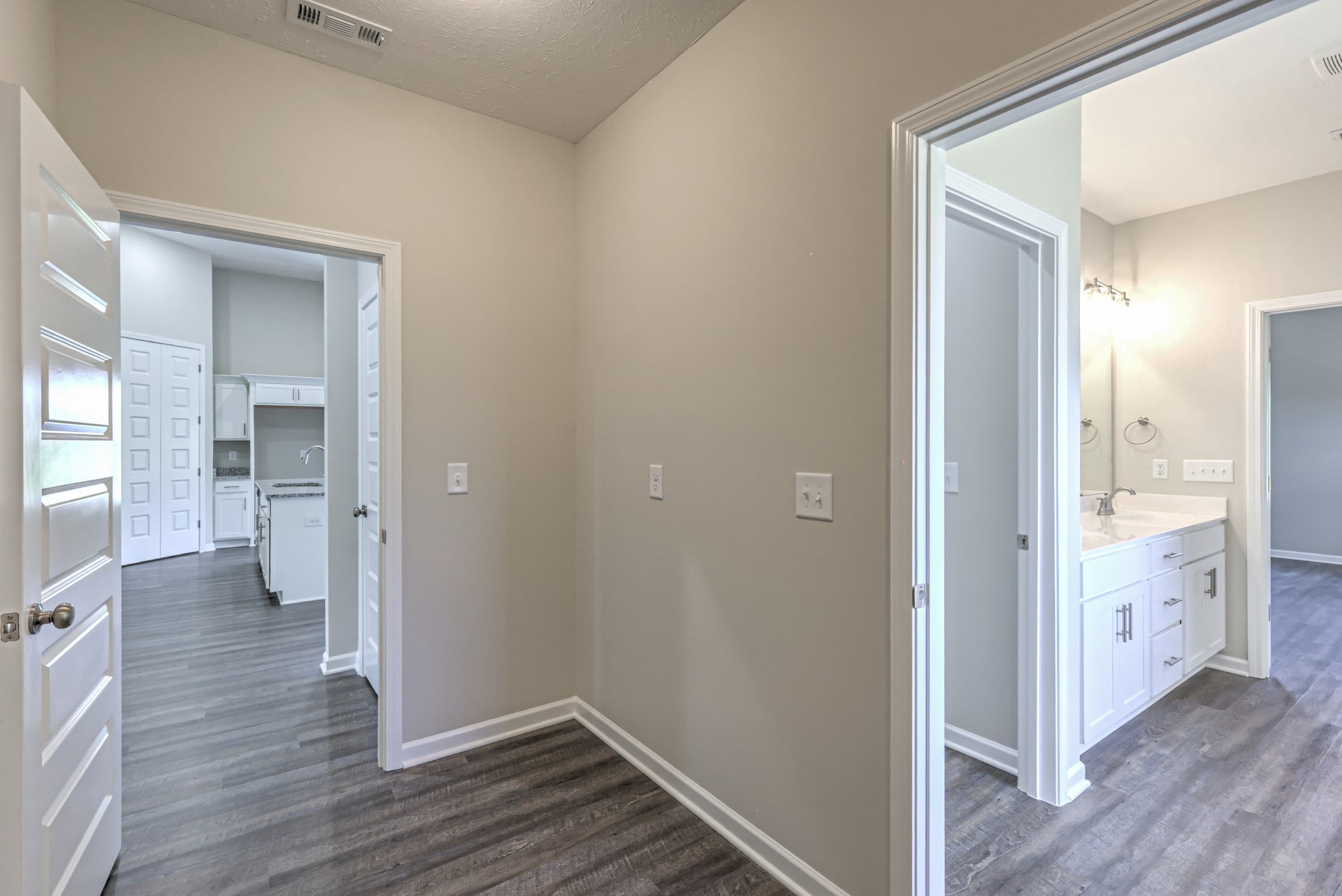 41 Bartow Street Decherd, TN 37324 - Photo 30 of 38 a view of a hallway with wooden floor and a bathroom