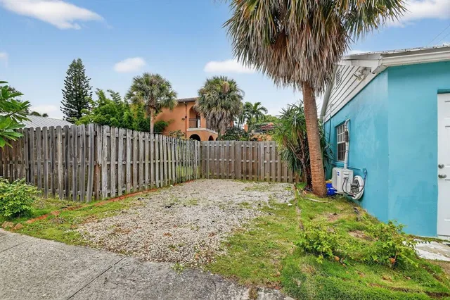a garden view with wooden fence