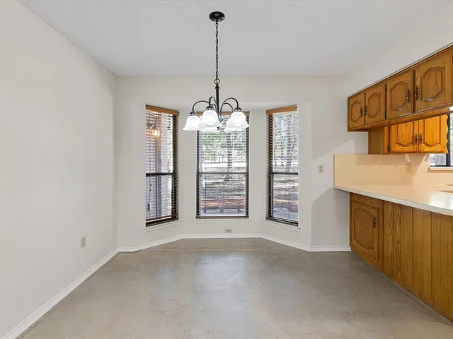 a view of a kitchen with a sink and dishwasher cabinets