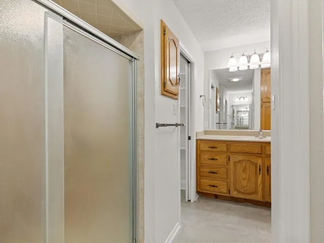 a bathroom with a granite countertop sink mirror and a