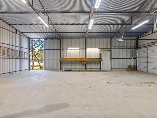 a view of a house with a tree