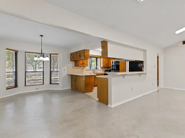 a view of a kitchen with a sink
