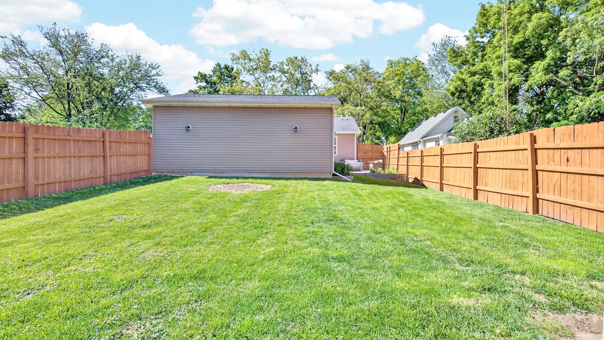 308 East Locust Street Normal, IL 61761 - Photo 32 of 40 a view of a backyard with a small cabin and wooden fence
