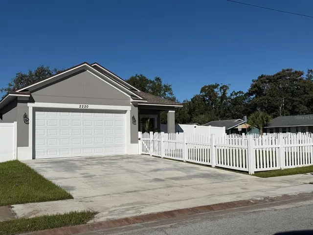 a front view of a house with a garage