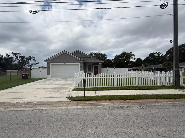 a view of a wrought iron fences in front of house