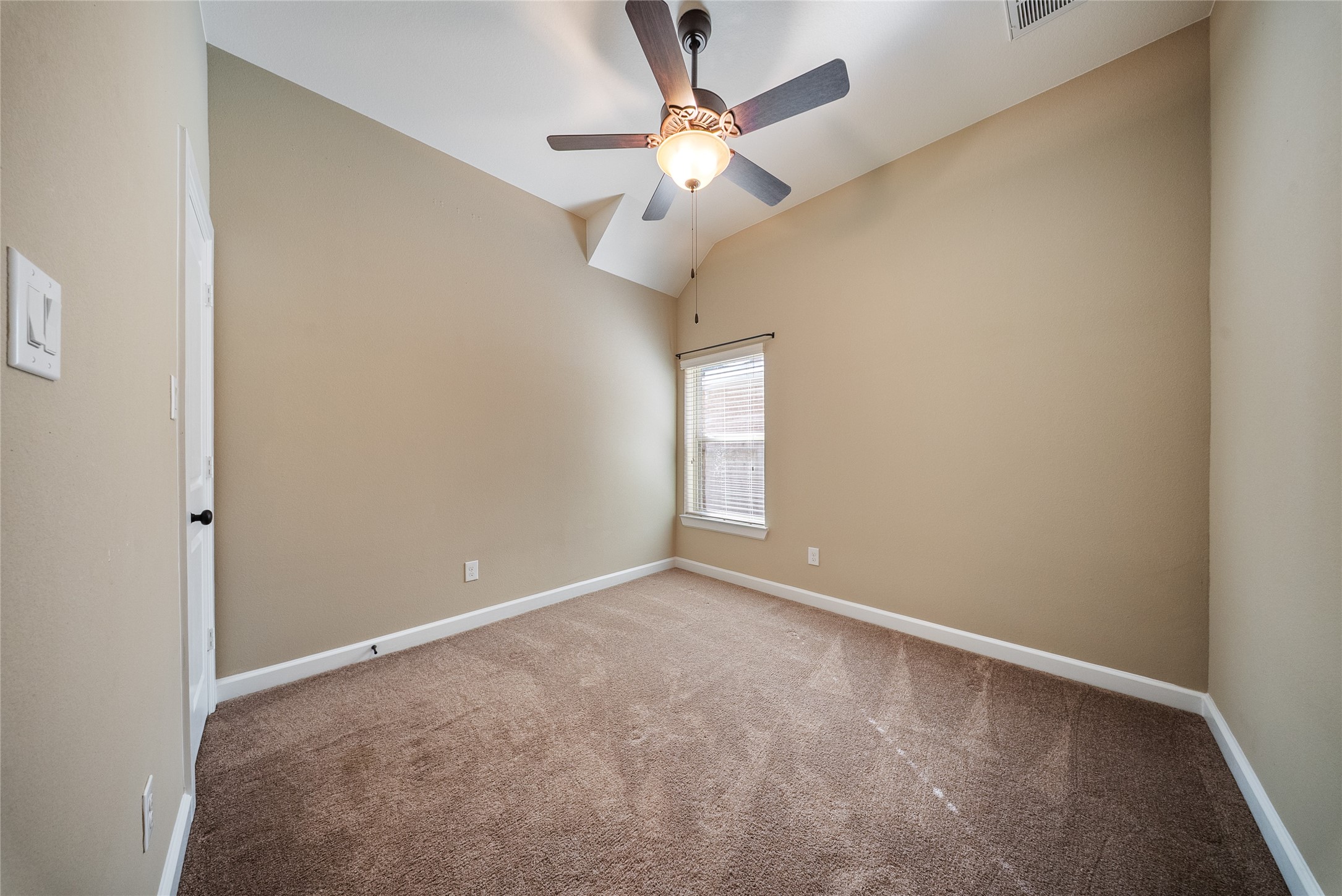 176 Castlegate Lane Houston, TX 77065 - Photo 11 of 33 a view of an empty room with a window
