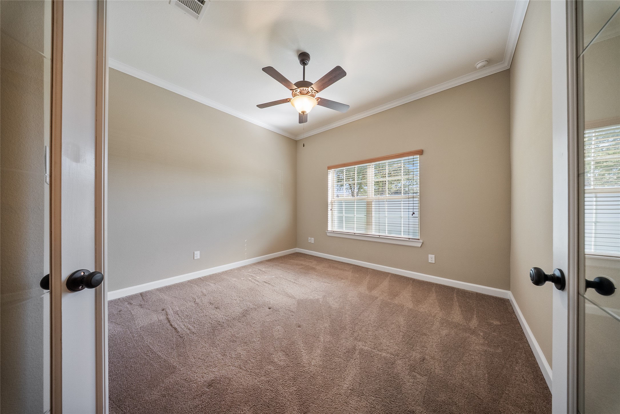 176 Castlegate Lane Houston, TX 77065 - Photo 13 of 33 a view of an empty room with a window