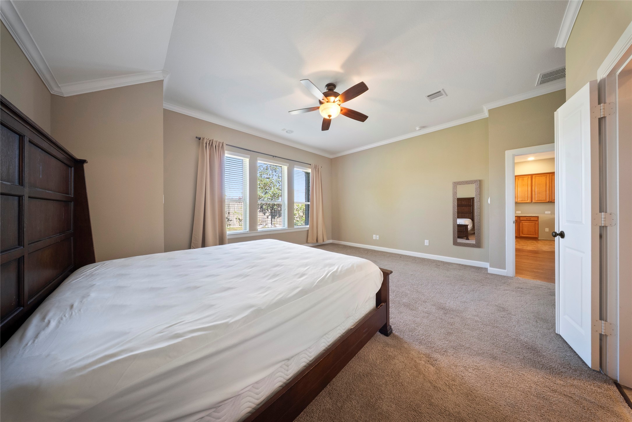 176 Castlegate Lane Houston, TX 77065 - Photo 20 of 33 a bedroom with a large bed dresser and a window
