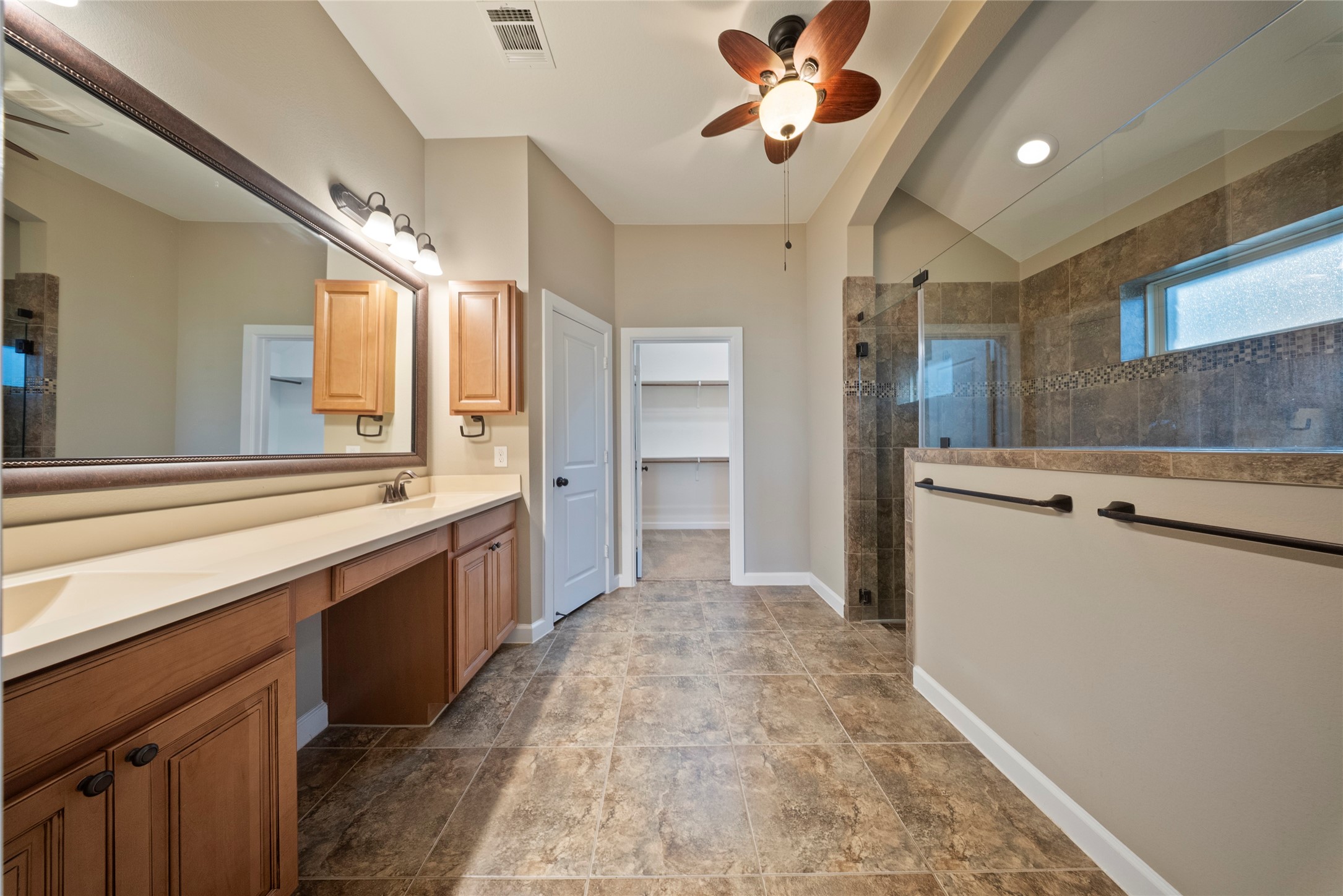 176 Castlegate Lane Houston, TX 77065 - Photo 21 of 33 a large white kitchen with a large window