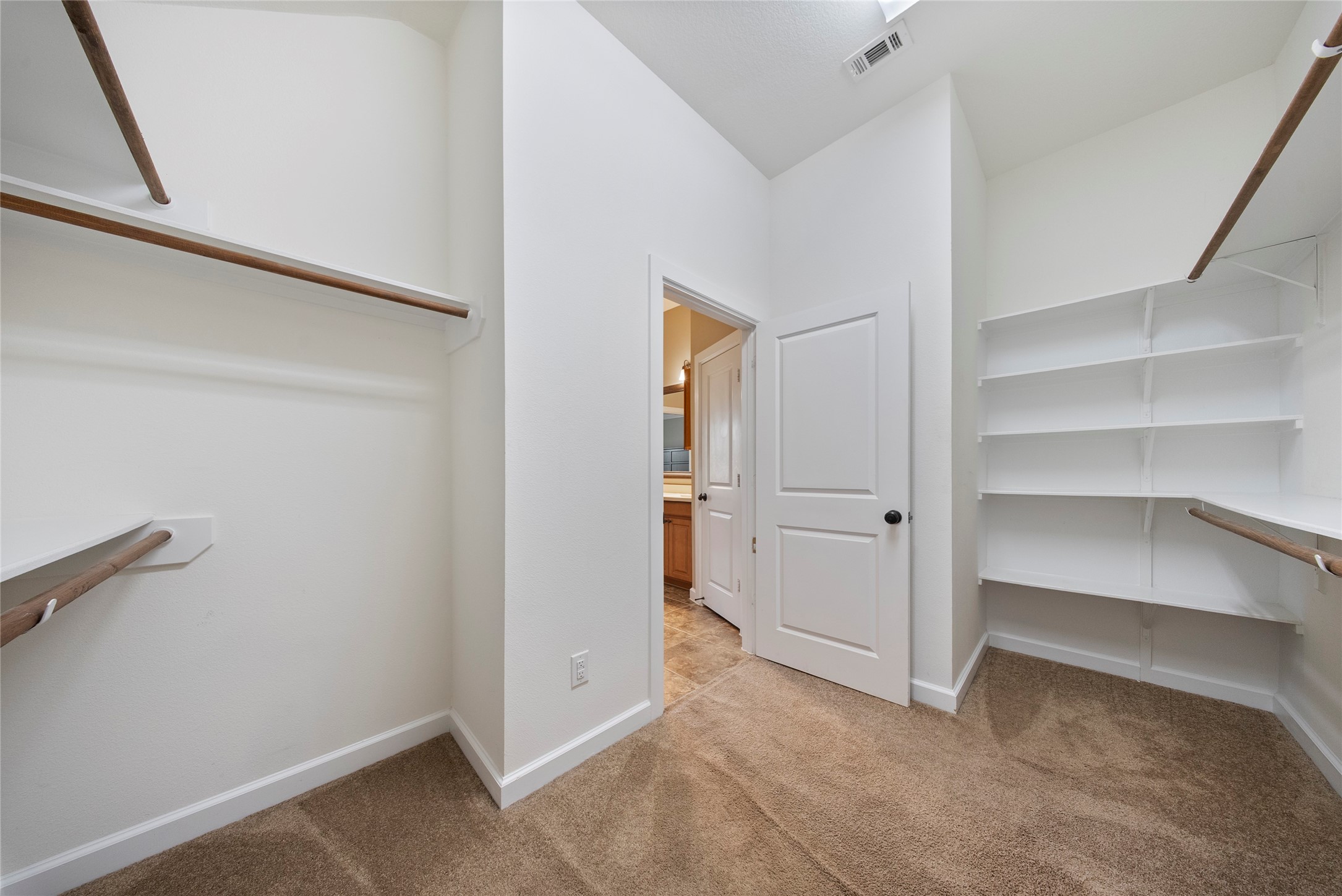 176 Castlegate Lane Houston, TX 77065 - Photo 24 of 33 a view of an empty walk in closet