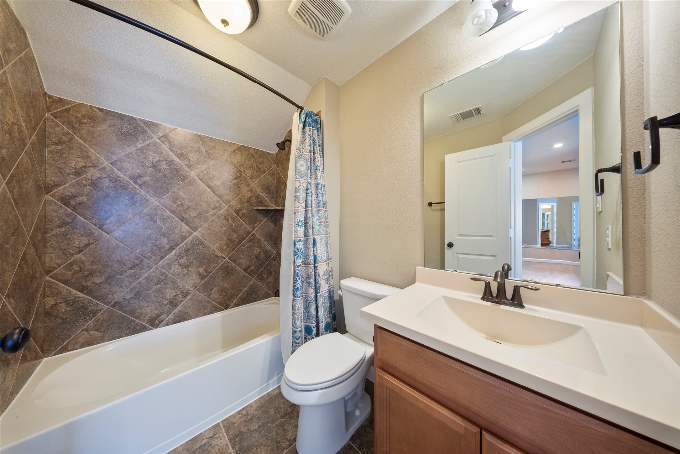 176 Castlegate Lane Houston, TX 77065 - Photo 28 of 33 a bathroom with a sink and a mirror