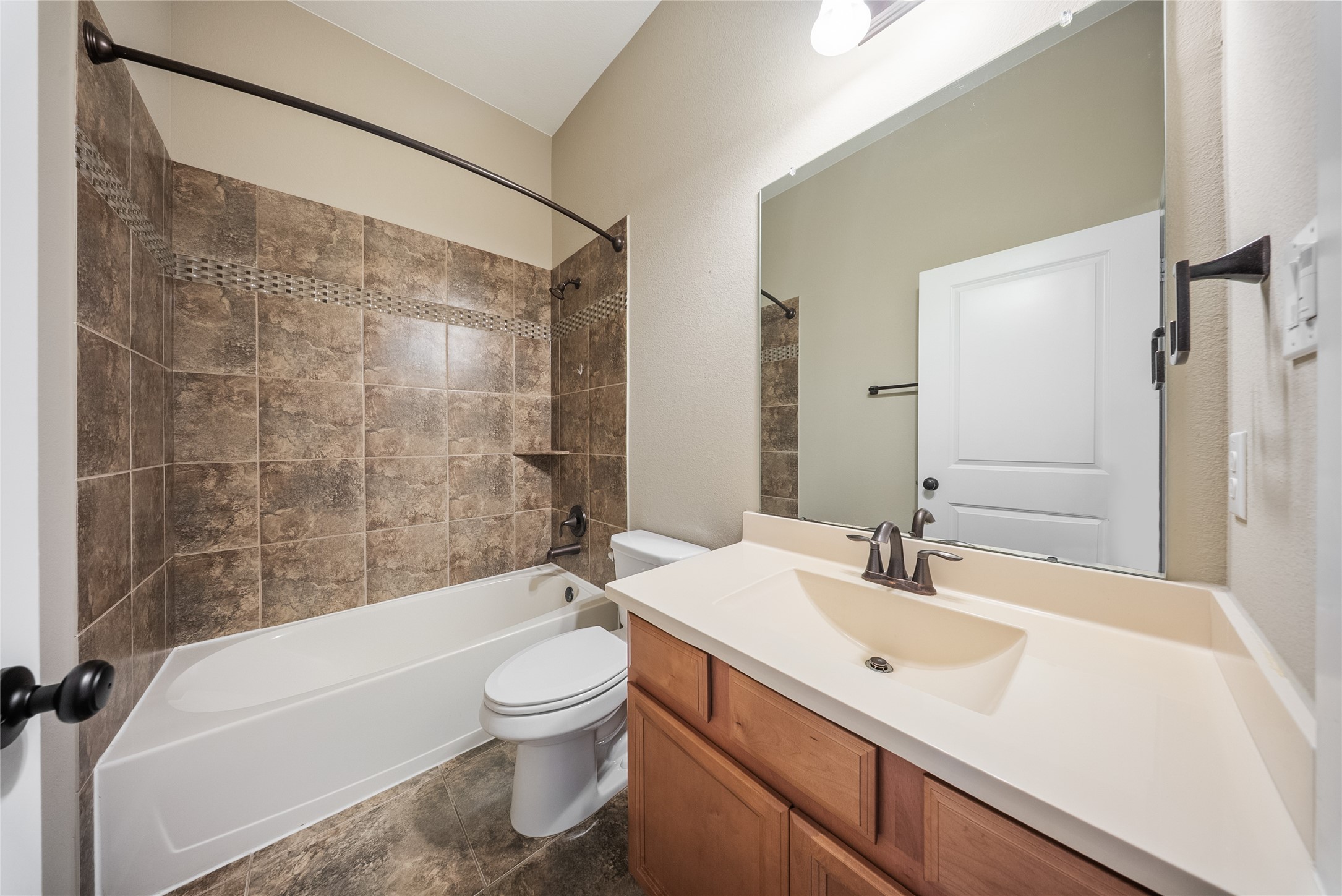 176 Castlegate Lane Houston, TX 77065 - Photo 9 of 33 a bathroom with a sink a toilet and shower