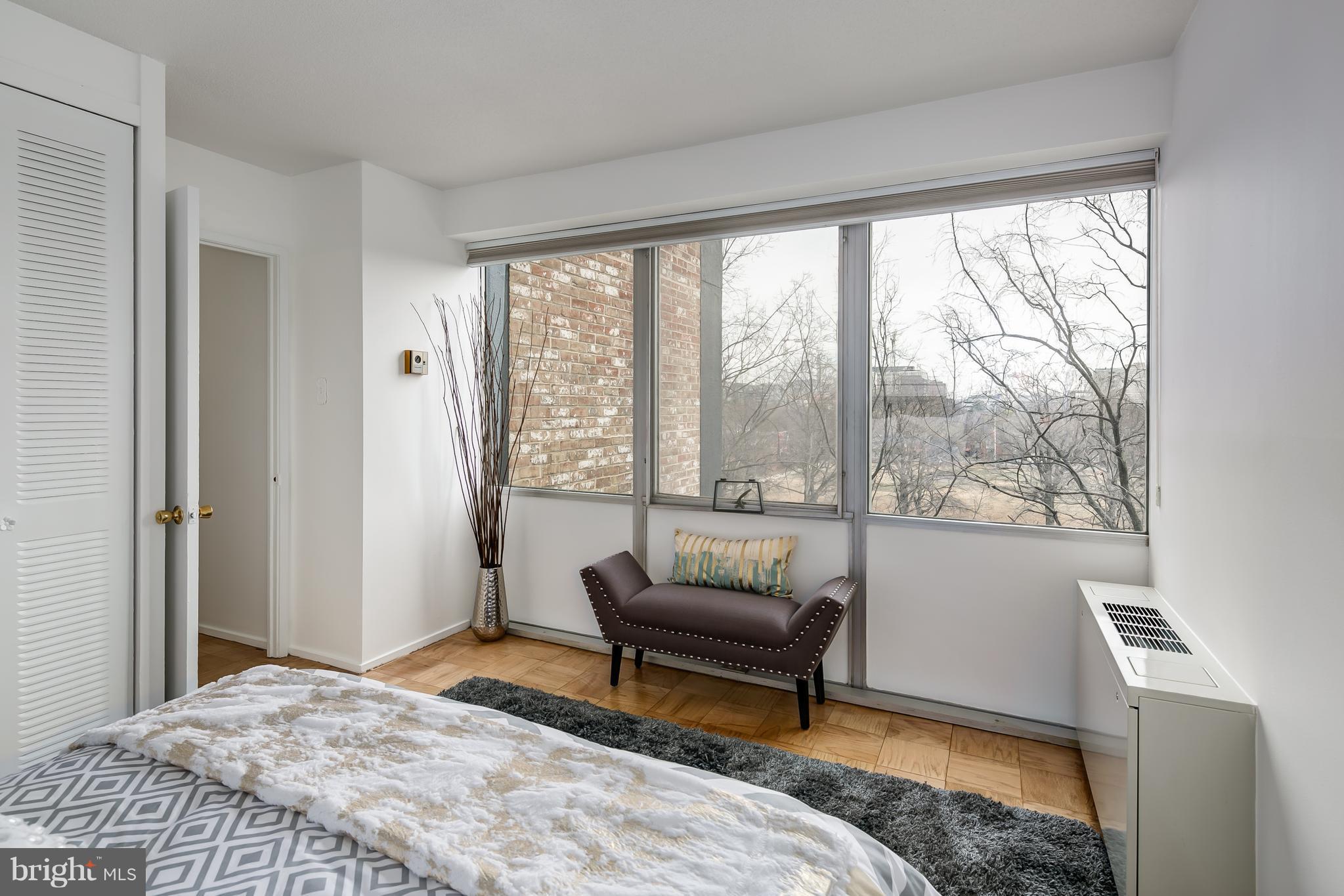 1301 Delaware Avenue Southwest, Unit N512 Washington, DC 20024 - Photo 17 of 28 a living room with furniture and a large window