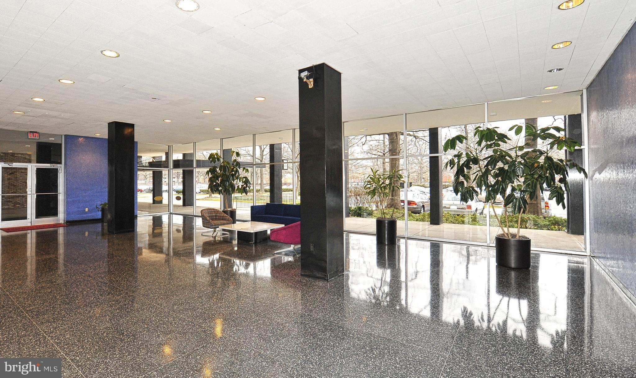 1301 Delaware Avenue Southwest, Unit N512 Washington, DC 20024 - Photo 23 of 28 a lobby with furniture and floor to ceiling window