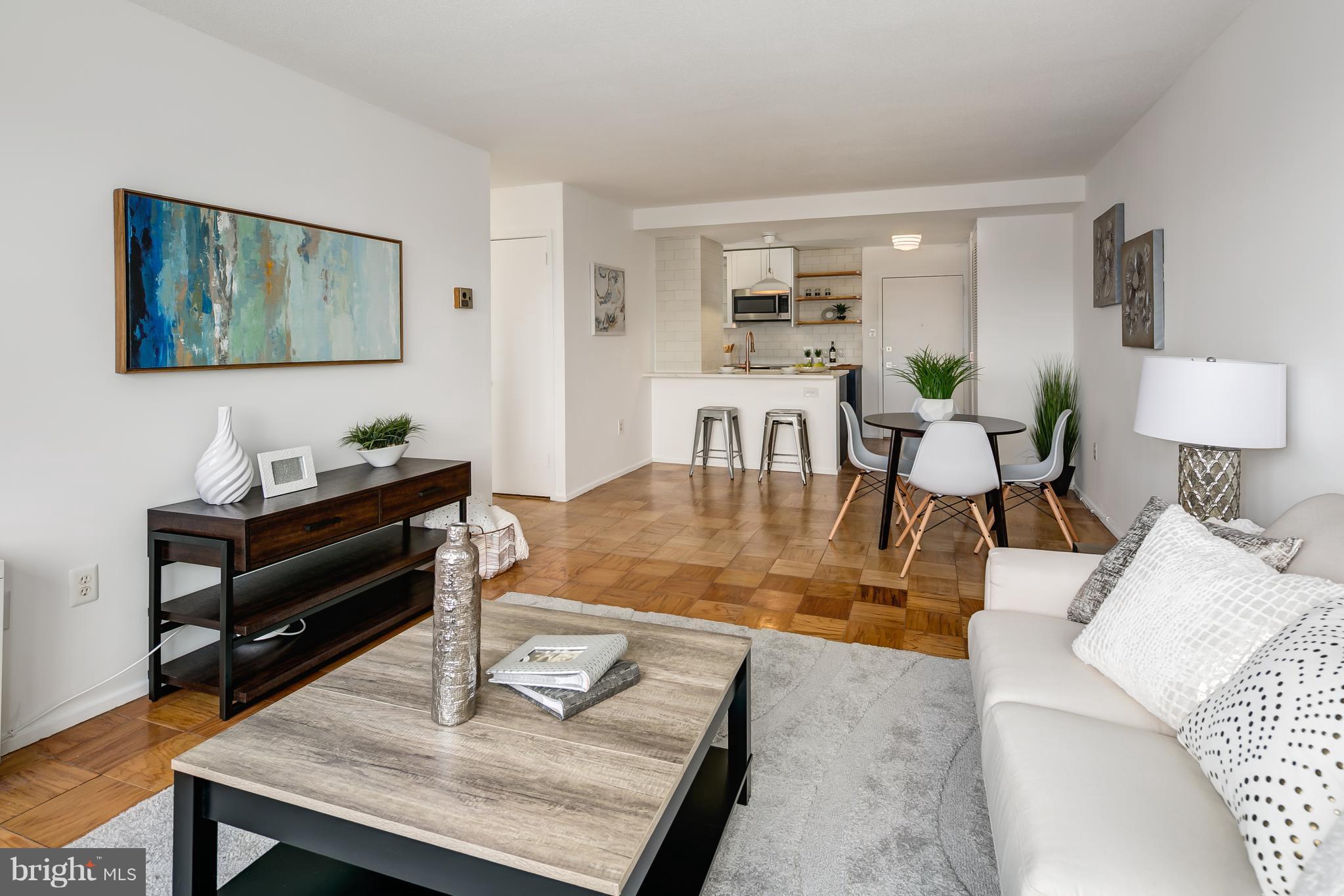 1301 Delaware Avenue Southwest, Unit N512 Washington, DC 20024 - Photo 9 of 28 a living room with furniture and wooden floor