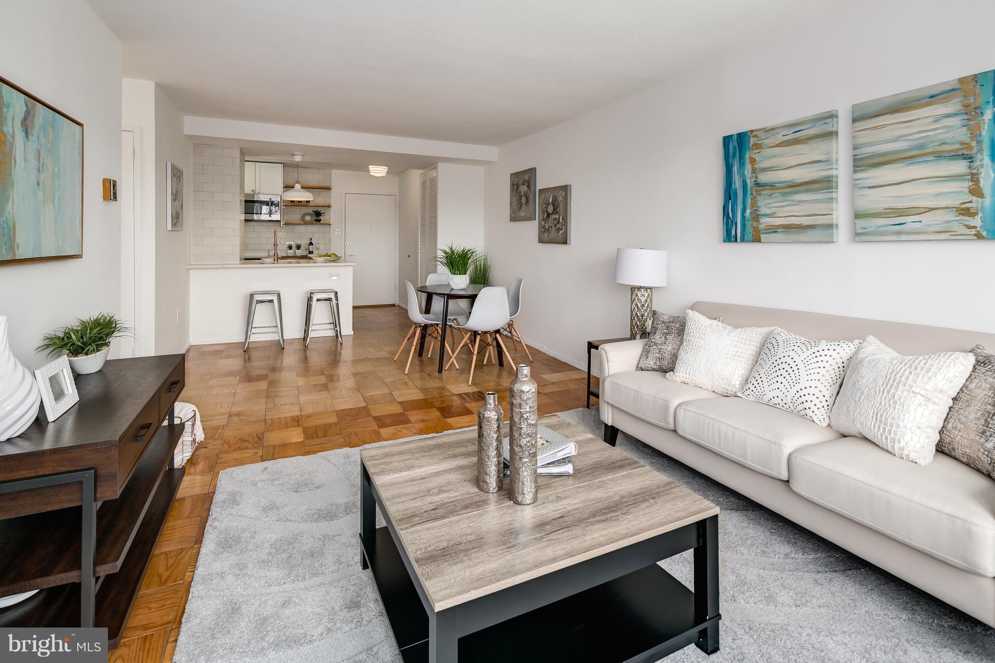 1301 Delaware Avenue Southwest, Unit N512 Washington, DC 20024 - Photo 10 of 28 a living room with furniture and wooden floor