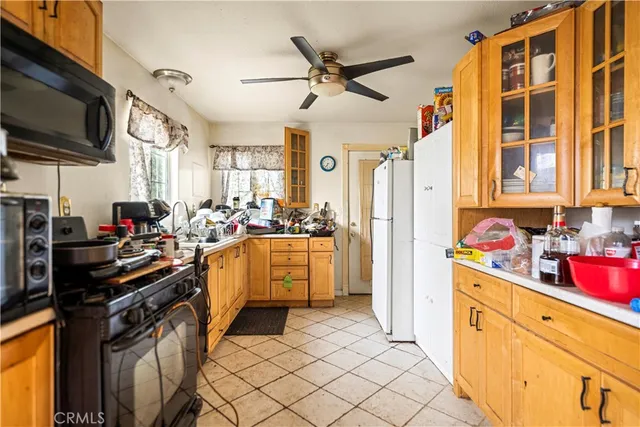 a spacious bedroom with a bed and wooden floor