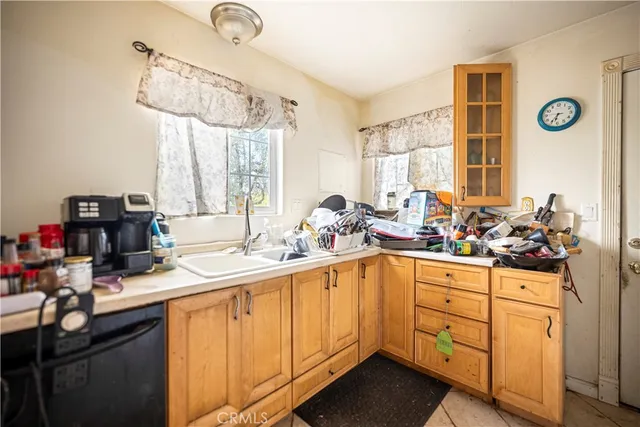 a bedroom with bed and a flat screen tv