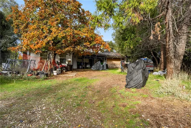 a view of a yard with swimming pool and sitting area