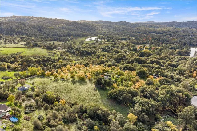 a view of a city with green field