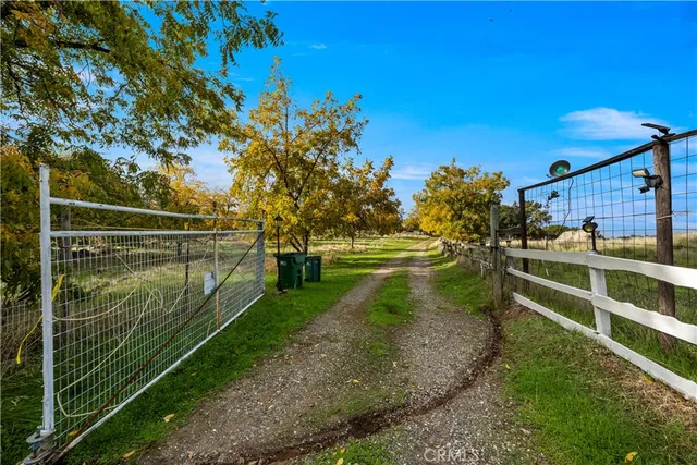 a living room with furniture fireplace and a large window