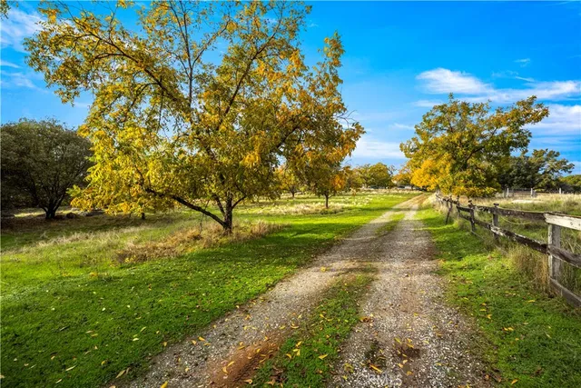 a kitchen filled with stainless steel appliances granite countertop a stove a sink and a refrigerator