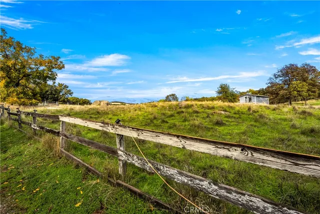 a kitchen with stainless steel appliances kitchen island granite countertop a refrigerator and a stove top oven