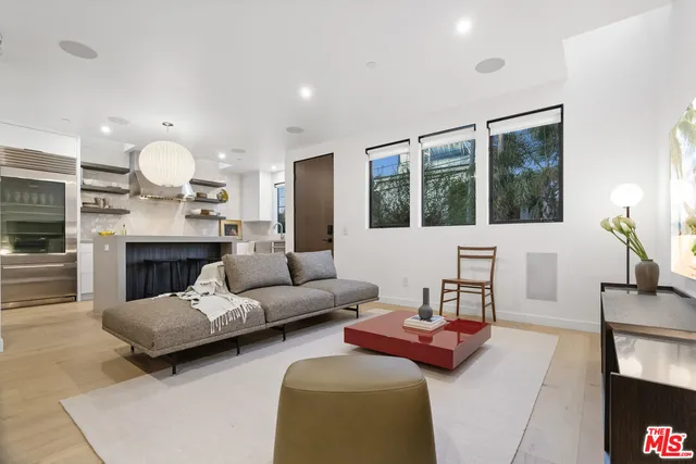a living room with furniture fireplace and a flat screen tv