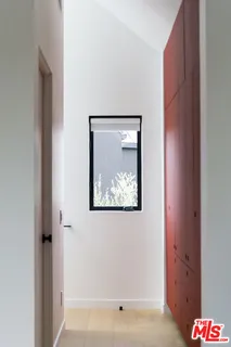 a bedroom with a bed and a table