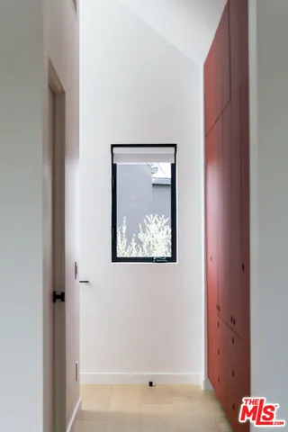 a bedroom with a bed and a table