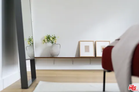 a bedroom with bed and chair