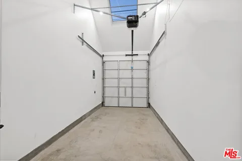 a couple of cars parked in front of a house