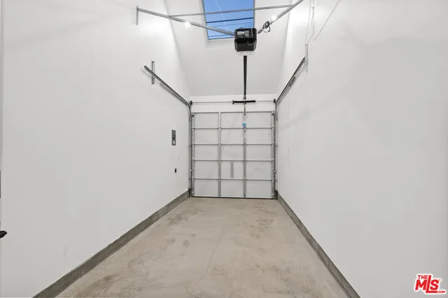 a couple of cars parked in front of a house