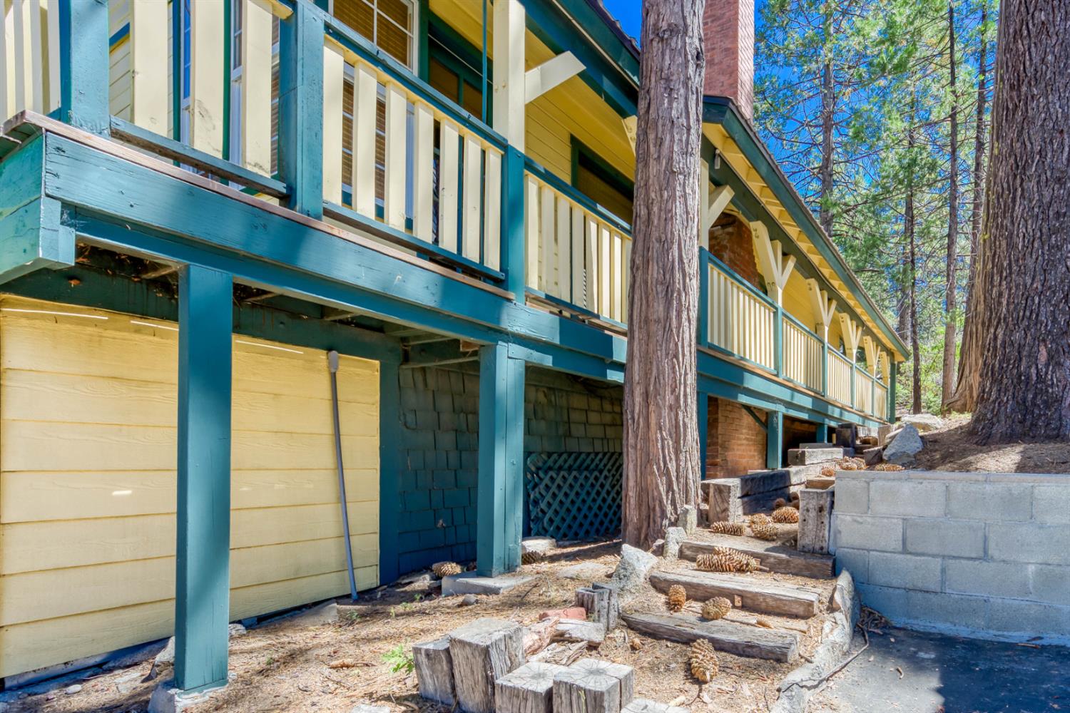 42025 Tollhouse Road Shaver Lake, CA 93664 - Photo 11 of 64 a view of a building with a window and door