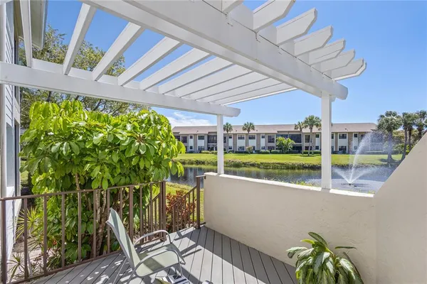 a view of swimming pool with outdoor seating and yard in back