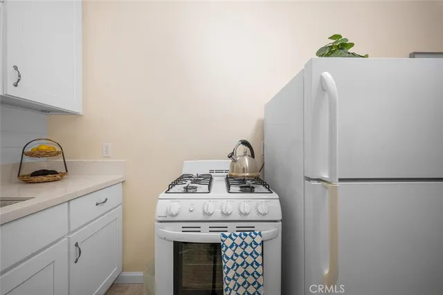 a utility room with sink dryer and washer
