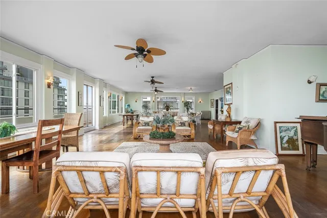 a view of a dining room with furniture wooden floor and chandelier