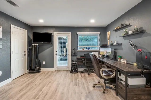 a view of a hallway with washer and dryer