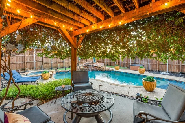 a view of a swimming pool with a patio